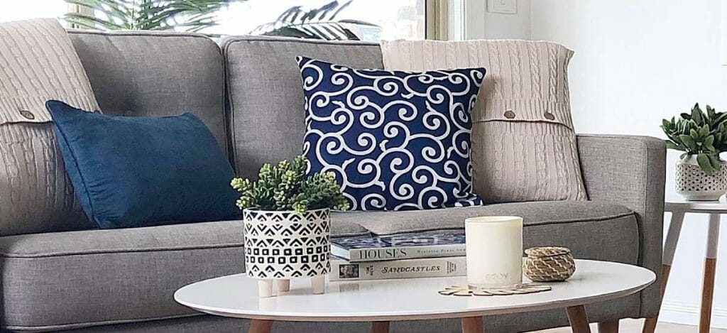 Kintted and patterned cushion in blue and cream for an added modern look.