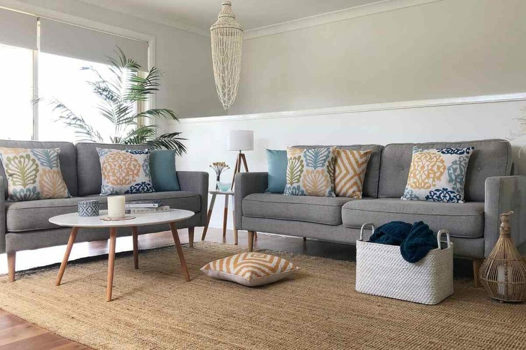Cushion accents in blue,gray and muted yellow for a ocean inspired aesthetic.