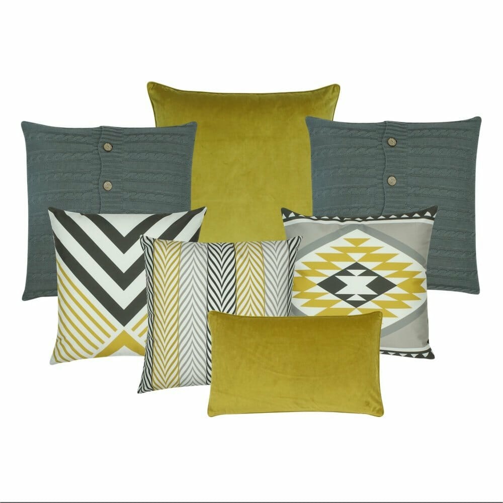 Velvet and Knitted Cushions in Grey and Mustard with a few patterned cushions.