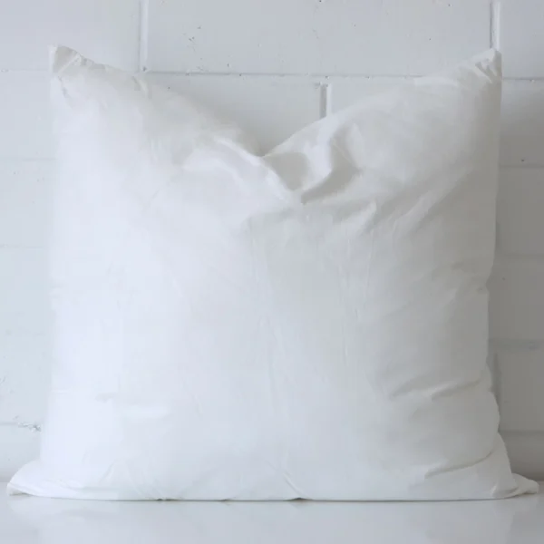 A 45x45 cushion insert inner made with a faux feather filling.