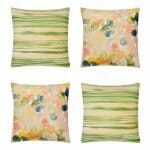 Image of 4 green and colourful cushion covers in watercolour motif