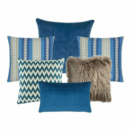 A set of six cushion cover collection with one plain blue cushion, two cushions with blue vertical stripes, one blue chevron pattern cushion, a brown faux fur cushion and a blue rectangular cushion.