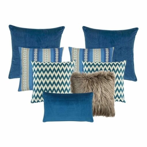 A photo of a set of eight cushion covers in blue and brown colours and patterns with seven square cushions and one rectangular.