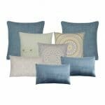 Stone blue and yellow cushions in varying sizes and textures