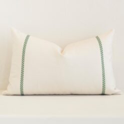 Striking rectangle cream cushion cover featuring a stripe style on quality outdoor fabric.