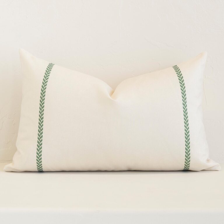 Striking rectangle cream cushion cover featuring a stripe style on quality outdoor fabric.