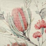 Close up image of floral themed cushion cover with pink posy print