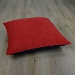Photo of two tone floor cushion cover in red and black colours