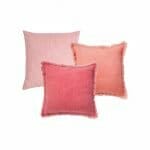 Photo of 3 indoor cushion cover collection in pink and salmon colours
