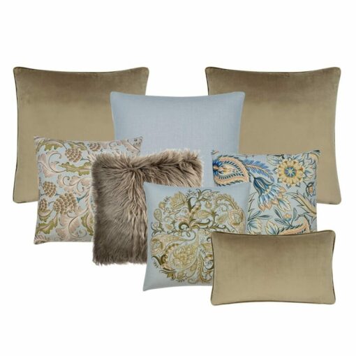 A photo of a stunning collection of eight cushion covers featuring three cushions with a paisley design, two brown cushions, a single soft teal cushion, one brown faux fur cushion and a rectangular brown cushion.