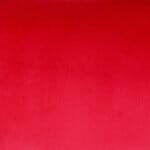 Close up image of red rectangular cushion cover made of velvet material