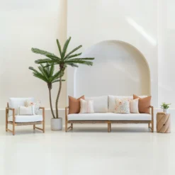 The claybourne set of 7 outdoor sofa cushions sitting on a white sofa.