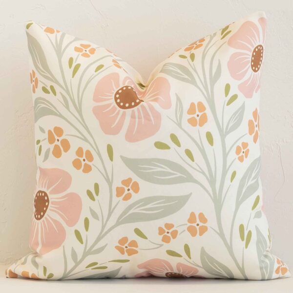 A gorgeous outdoor pink and green square cushion. It has an eye-catching floral design.