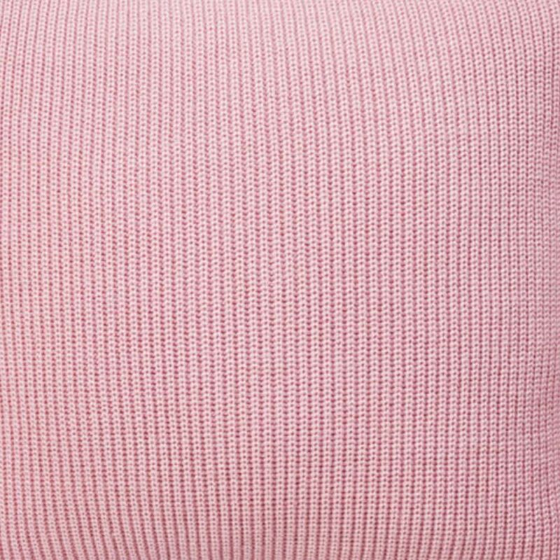 Close up image of pink knitted cushion cover