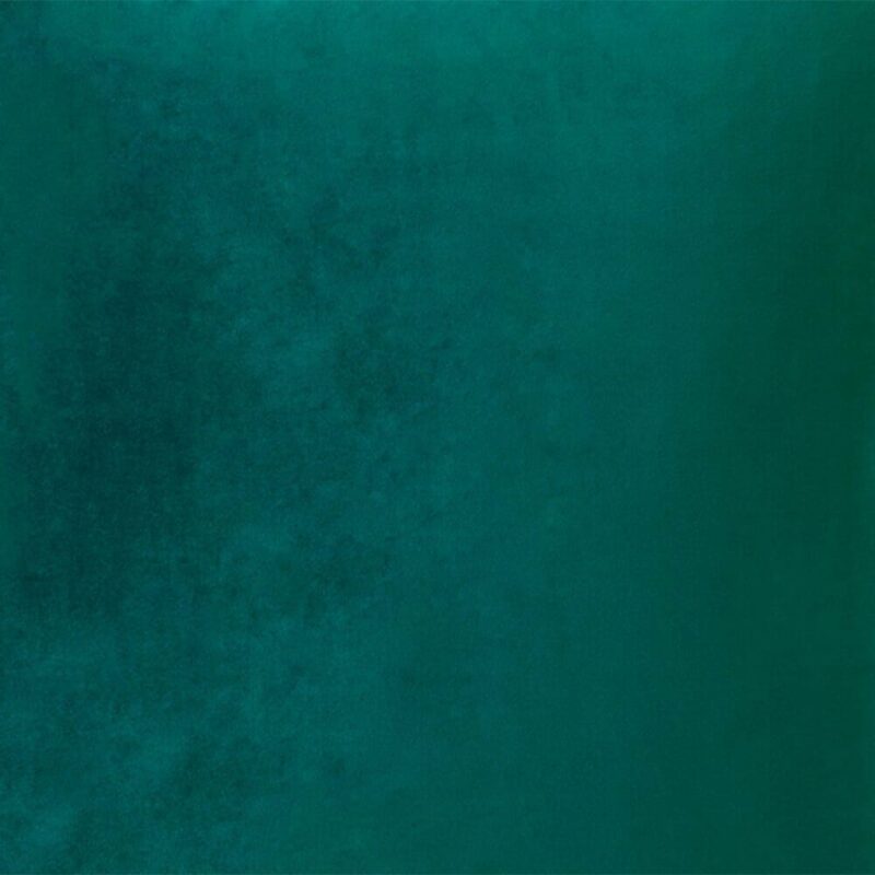 Close up image of emerald green velvet cushion cover