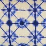 Close up of tie-dye inspired rectangular cushion cover in blue and white colours