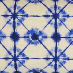 Close up of tie-dye inspired rectangular cushion cover in blue and white colours