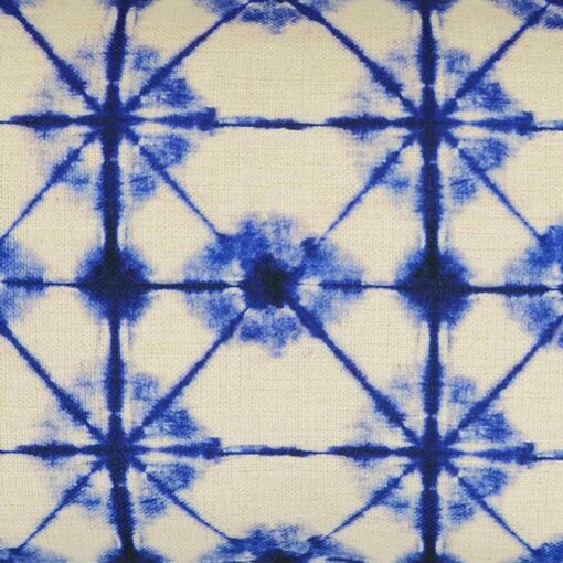 Close up of tie-dye inspired rectangular cushion cover in blue and white colours