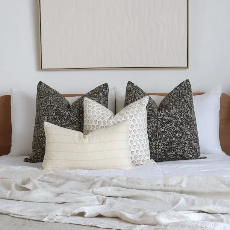 A white bedroom looks classy with the 4 Essa designer bed cushions perfectly placed on a bed.