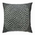 Image of black outdoor cushion with white polka dots
