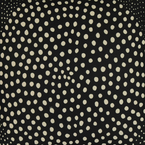 Close up of ethnic inspired black outdoor cushion made of UV resistant material