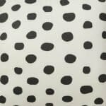 Close up image of polka dot cushion cover made of outdoor cotton fabric