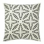 Photo of white cushion with black tribal star pattern
