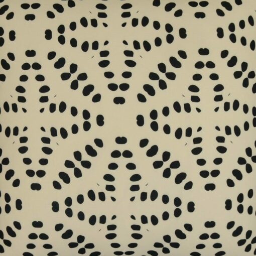 Close up of outdoor cushion with black polka dots
