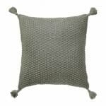 Image of grey knitted cushion cover with tassels