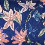 Close up image of rectangular cushion cover with blue and pink flowers