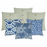 A pair of cushion in cable knit design with buttons, one piece cable knit cushion, 3 multi patterned cushion in blue and white colours.