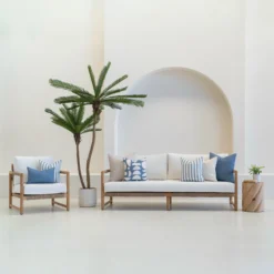 Set of 7 horizon cove outdoor sofa cushions is arranged neatly on a white sofa.