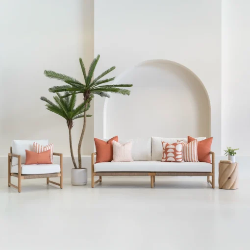 7 outdoor sofa cushions in a horizon rust colour shown on a white sofa.