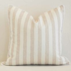 A graceful square sand cushion with a stripe style on durable outdoor fabric.