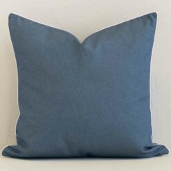 An alluring outdoor large cushion cover in blue. It features an attractive solid-colour style.