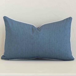 A solid-coloured outdoor cushion in a sleek rectangle size with a blue tone of colour.