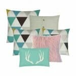 A collection of 6 cushion covers in natural, teal and pink colours, triangle designs and a scandi design feel.