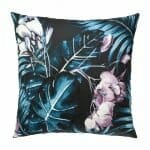 Close up image of green outdoor cushion cover with floral design