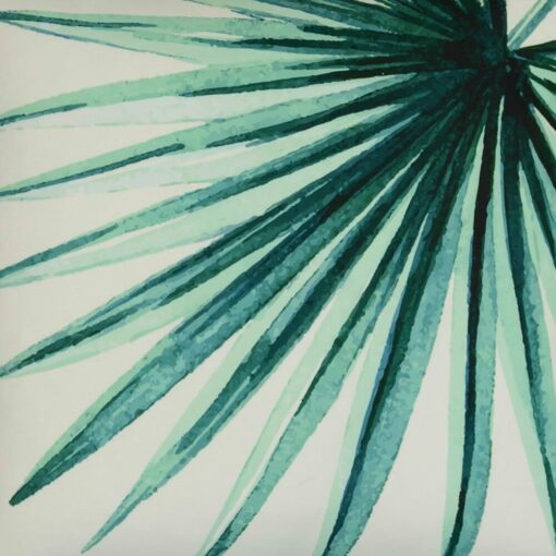 Close up image of UV resistant outdoor cushion cover with green fern on white fabric