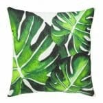 Photo of green and white cushion with leaves