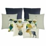 A pair of black cushion cover, a pair of white cushion cover, a pair of cushion cover with triangle designs, one square cushion with moose print and one rectangular cushion with moose print.