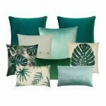 Mixture of 9 cushions with green and white velvet, knit and fabrics