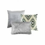 A photo of a single silver square cushion cover, a grey diamond pattern cushion cover and one grey rectangular faux fur cushion.