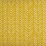 Close up photo of yellow rectangular cushion cover in African tribal print
