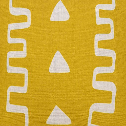 Close up image of mud cloth motif cushion cover in yellow mustard colour