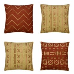 Photo of 4 cushions with beige and rust coloured tribal prints