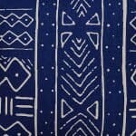 Close up image of African tribal cushion cover in navy blue and white colours