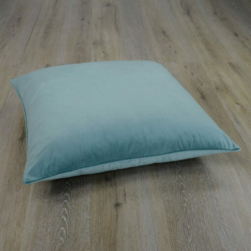 Image of mint coloured floor cushion made of velvet fabric