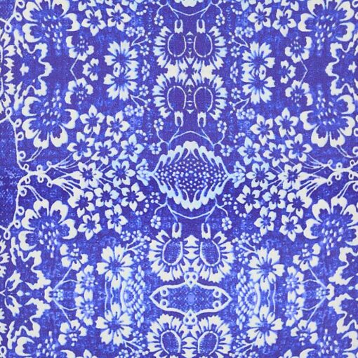 Close up image of blue cushion cover with floral pattern