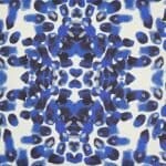 Close up image of blue and white square outdoor cushion cover in Mykonos style